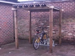 To remove old run down shed to covered bike shelter.
